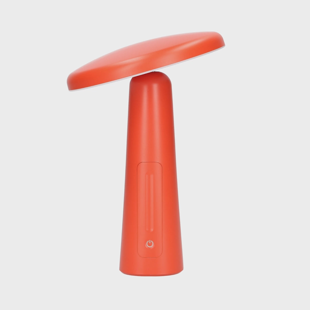 360 Grad Ansicht einer kabellosen LED Tischleuchte in Rot.